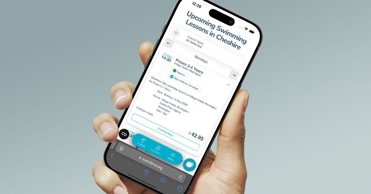 Image of person holding an iPhone with a timetable of swimming lessons they can book